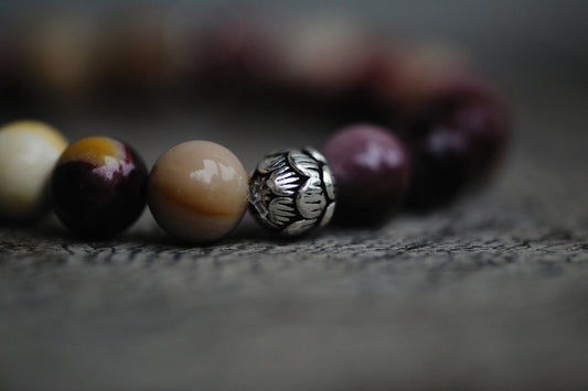 a close up of a bracelet with beads
