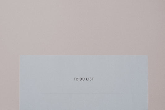 a piece of paper with the words to do list on it