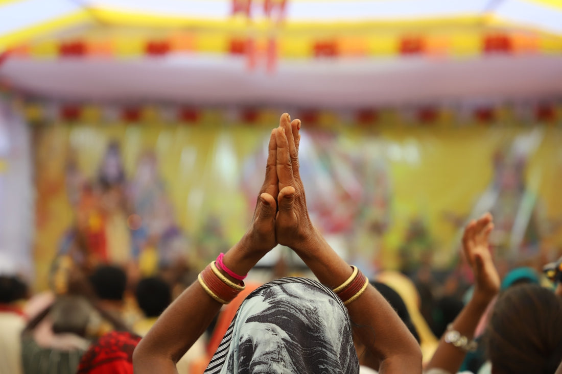 a group of people standing in front of a stage