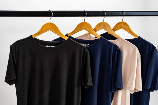 a group of blue and yellow shirts on a swinger