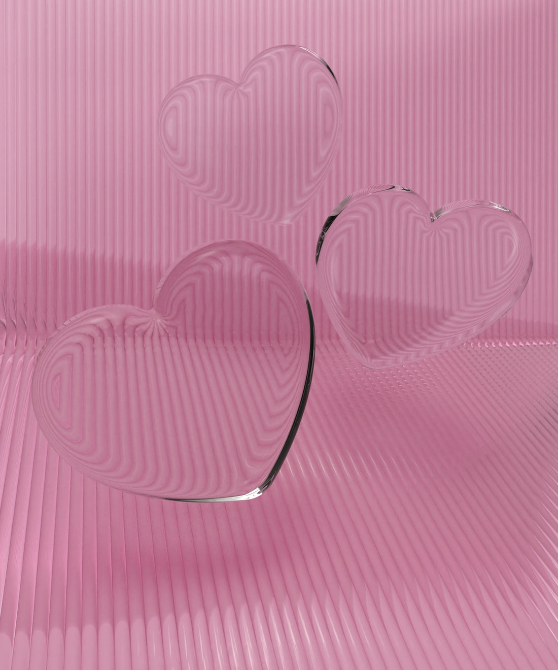 a couple of heart shaped glasses sitting on top of a table
