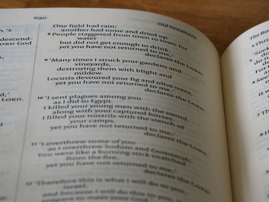 a close up of an open book on a table