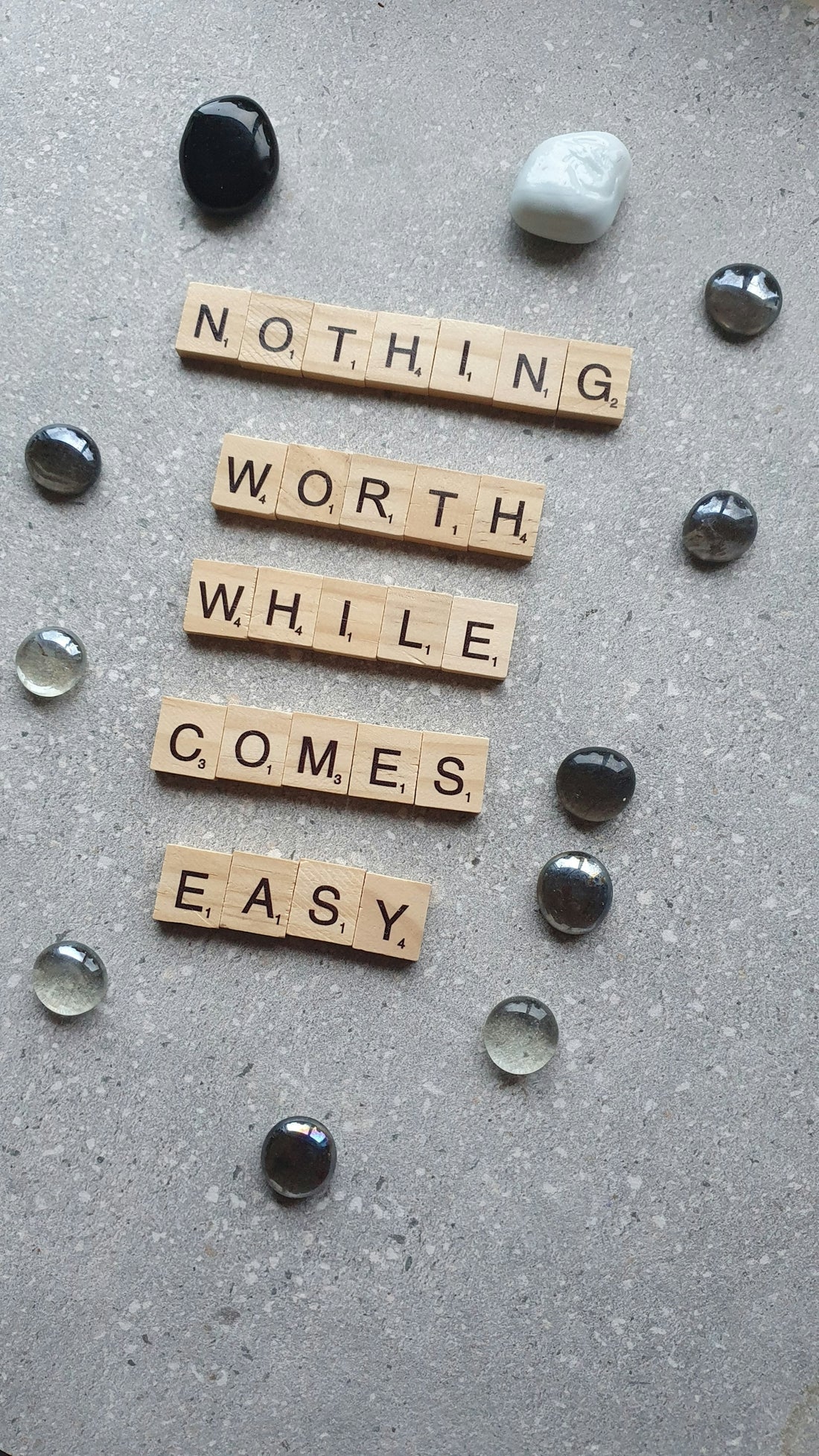 scrabble tiles spelling nothing worth while comes easy