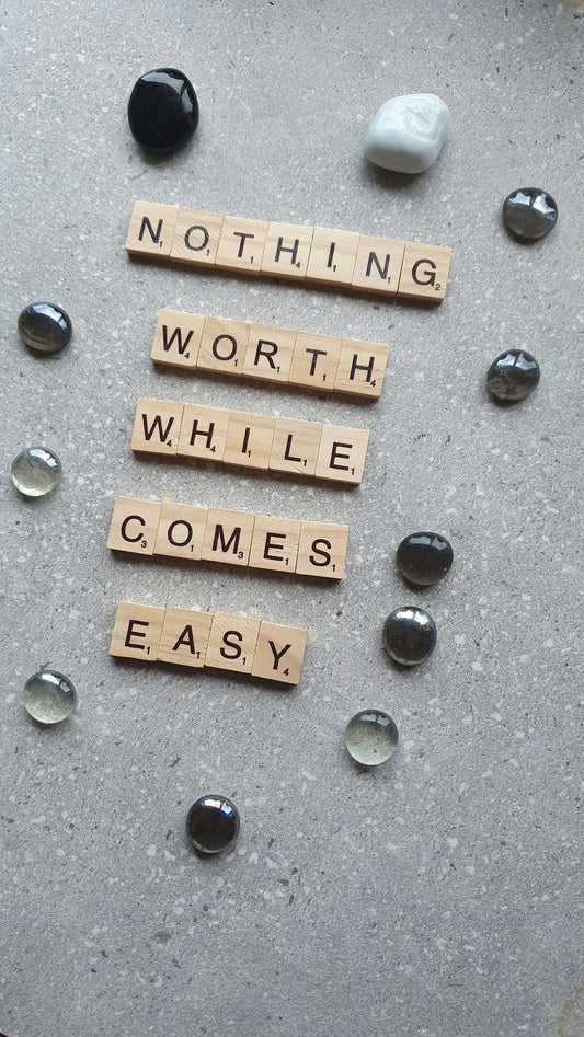 scrabble tiles spelling nothing worth while comes easy