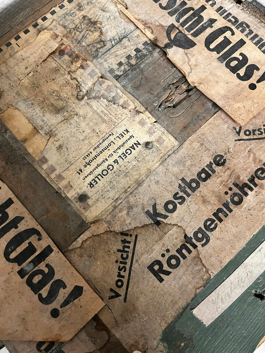 A pile of old newspapers sitting on top of a table