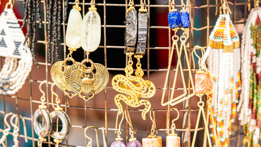 Jewelry display with various earrings and necklaces.