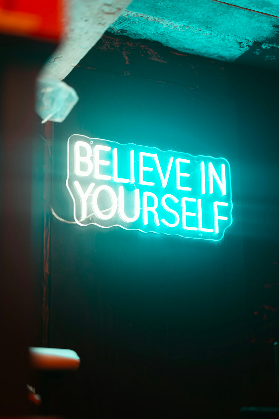 Neon sign says believe in yourself