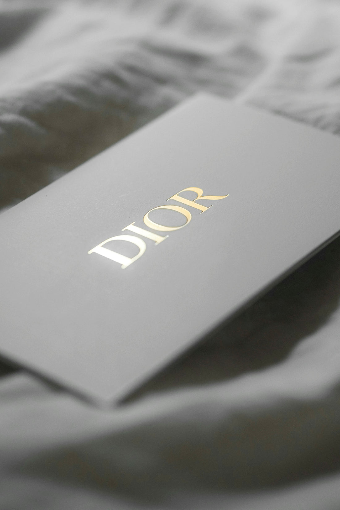 Dior logo on a white card