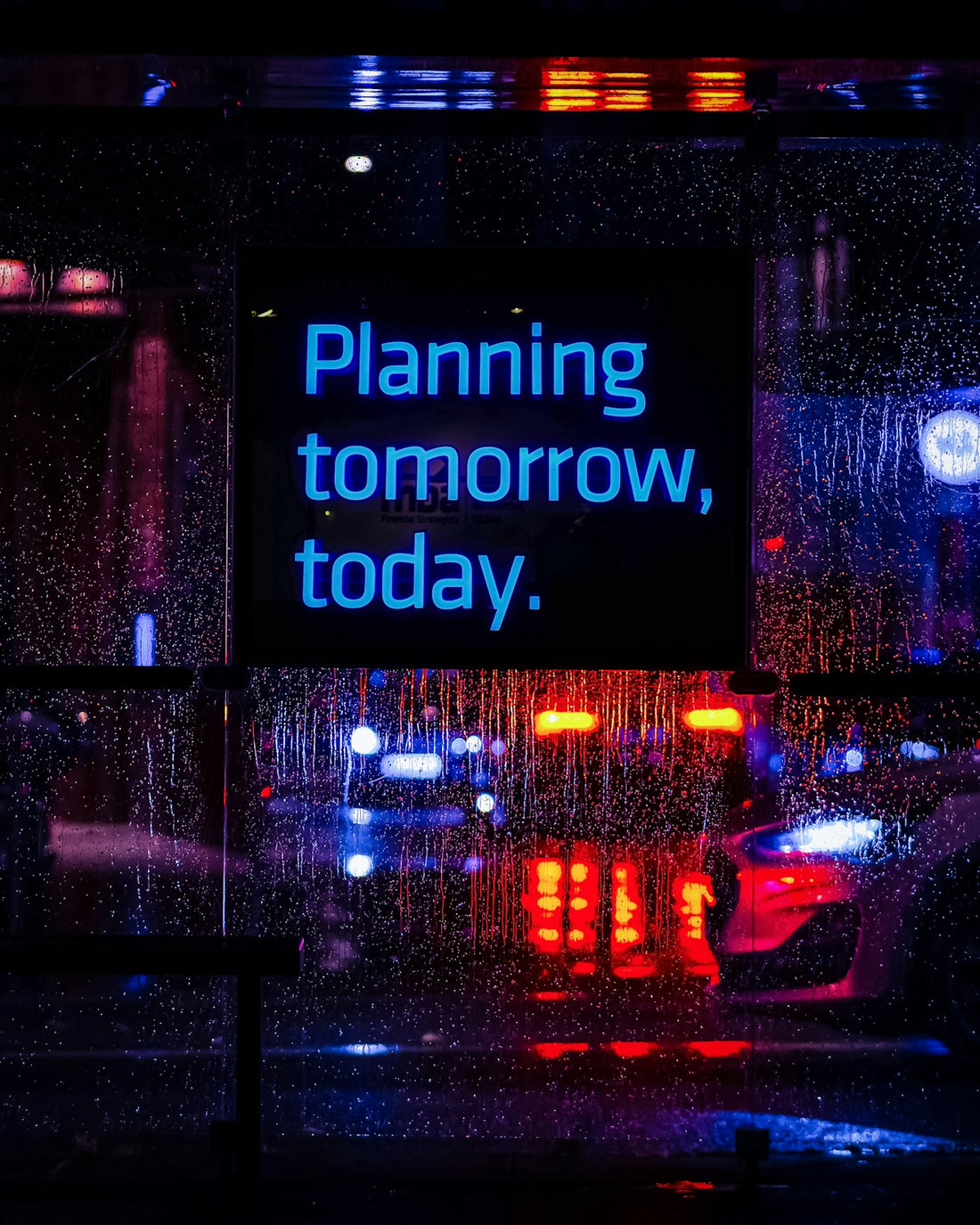 Neon sign reads planning tomorrow, today.