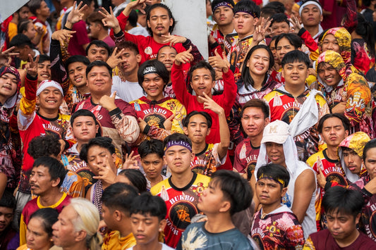 A large crowd of people in colorful attire